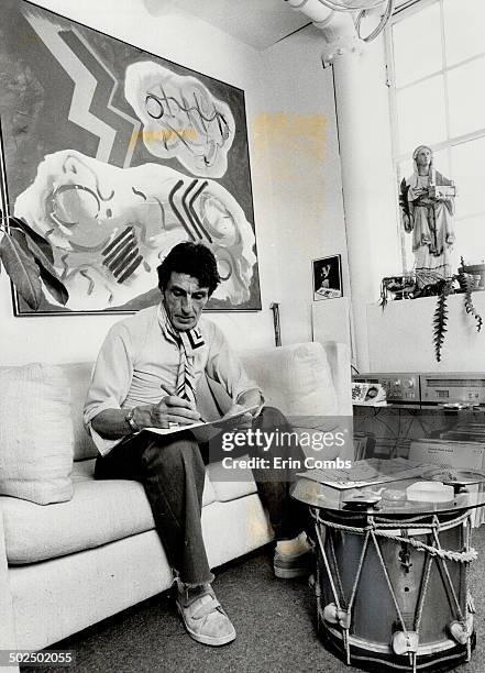 Artist at work: Pollock sketches in studio area accented with Victorian collectibles. Old drum serves as a coffee table.