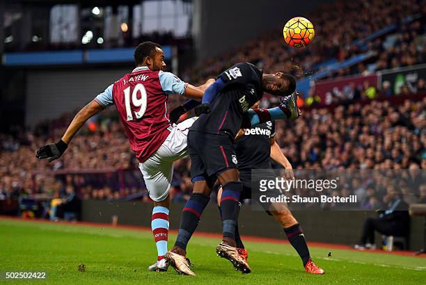 Jordan Ayew of Aston Villa battles for the ball with Pedro Mba Obiang of West Ham United during the Barclays Premier League match between Aston Villa...