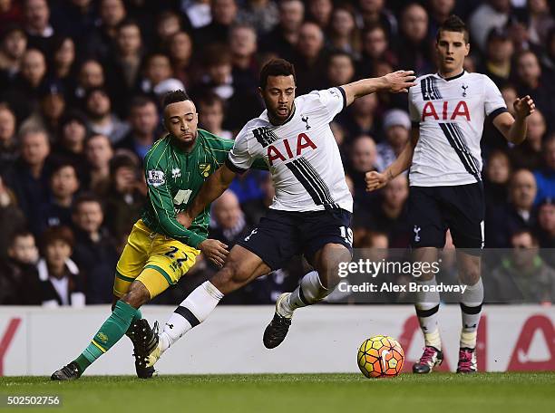 Mousa Dembele of Tottenham Hotspur is challenged by Nathan Redmond of Norwich City during the Barclays Premier League match between Tottenham Hotspur...