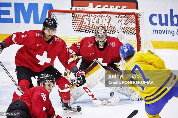 Sweden's Dmytro Timashov shoots to score the 1-3 goal past Switzerland's goalkepper Gauthier Descloux during the 2016 IIHF World Junior Ice Hockey...