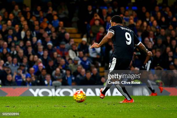 Troy Deeney of Watford scores his team's first goal from the penalty spot during the Barclays Premier League match between Chelsea and Watford at...