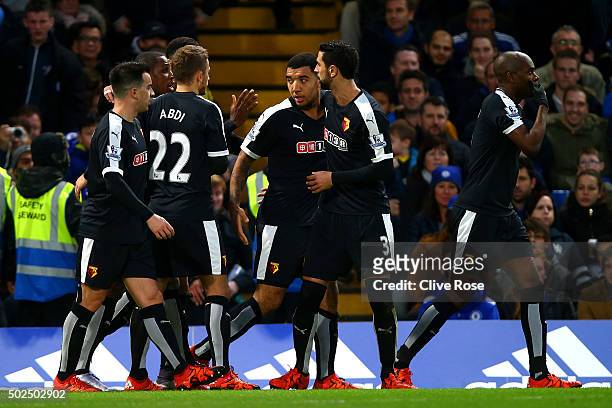 Troy Deeney of Watford celebrates with team-mates after scoring their first goal from the penalty spot during the Barclays Premier League match...