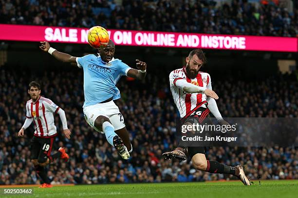 Steven Fletcher of Sunderland takes a shot on goal under pressure from Eliaquim Mangala of Manchester City during the Barclays Premier League match...