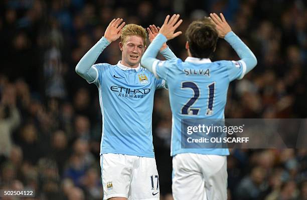 Manchester City's Belgian midfielder Kevin De Bruyne celebrates with Manchester City's Spanish midfielder David Silva after scoring their fourth goal...