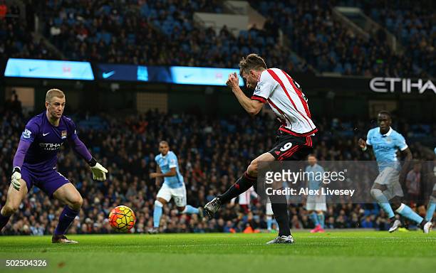 Fabio Borini of Sunderland shoots past Joe Hart of Manchester City to score a goal during the Barclays Premier League match between Manchester City...