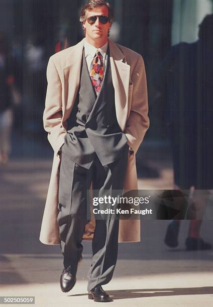 Well Suited: Danny Sullivan wears teal and black weave double-breasted suit; $950; dress shirt; $95; tie; $95; and overcoat; $950; all from the new...