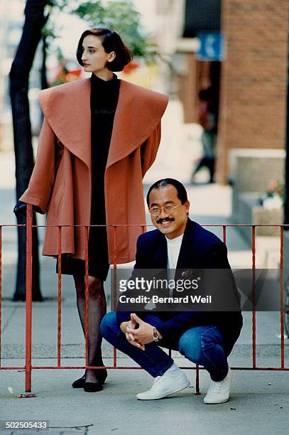 The idea was to have a collection that looks and feels luxurious. - Alfred Sung. Model wears apricot colored cashmere and wool long jacket with a...