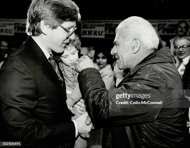The human touch: Ontario NDP leader Bob Rae smiles at a supporter at Yorkview committee rooms who tickles the cheek of Judith Rae; 31/2; sleepy...