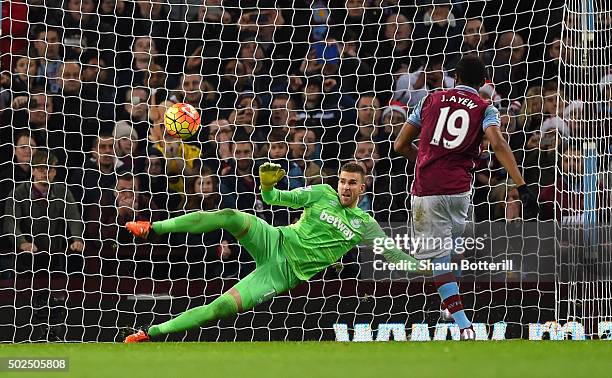 Jordan Ayew of Aston Villa scores his side's first goal from the penatly spot past Adrian of West Ham United during the Barclays Premier League match...