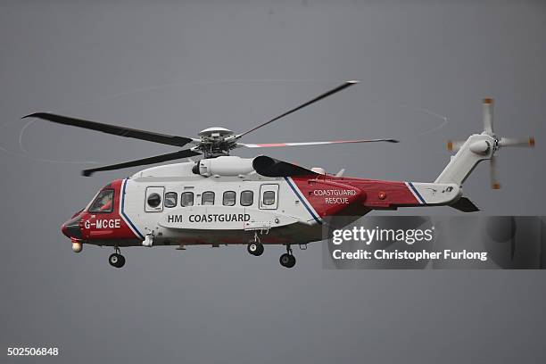 Coastguard helicopter prepares to carry out a rescue operation as floodwaters rise after rivers burst their banks on December 26, 2015 in...