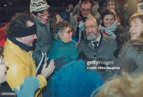 Victory smile: A beaming Dr. Henry Morgentaler is surrounded by equally pleased supporters outside his Harbord St. Clinic yesterday after a Supreme...