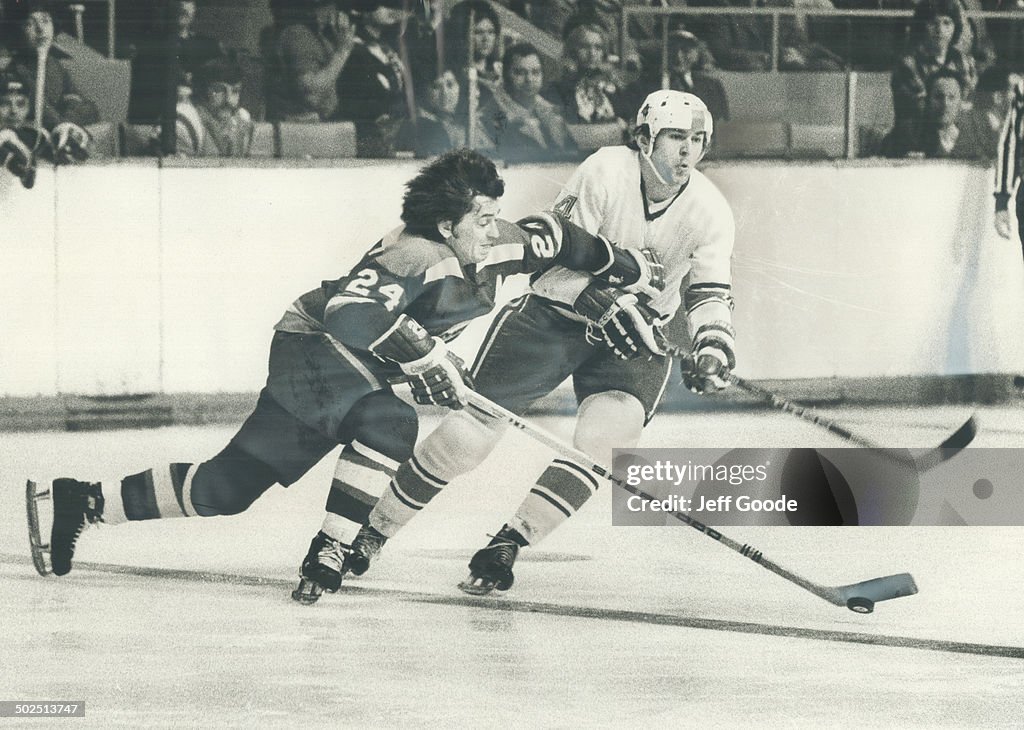 Clutch and garb: Indianapolis Racers' Ken Block (24) tries to fend off Toros' Vaclav Nedomansky by g