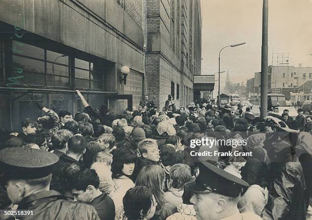 Beatlemania hits Toronto: They say the Beatles are only a passing fad but you'd never guess it from their fans-an estimated 4,000 strong - who braved...