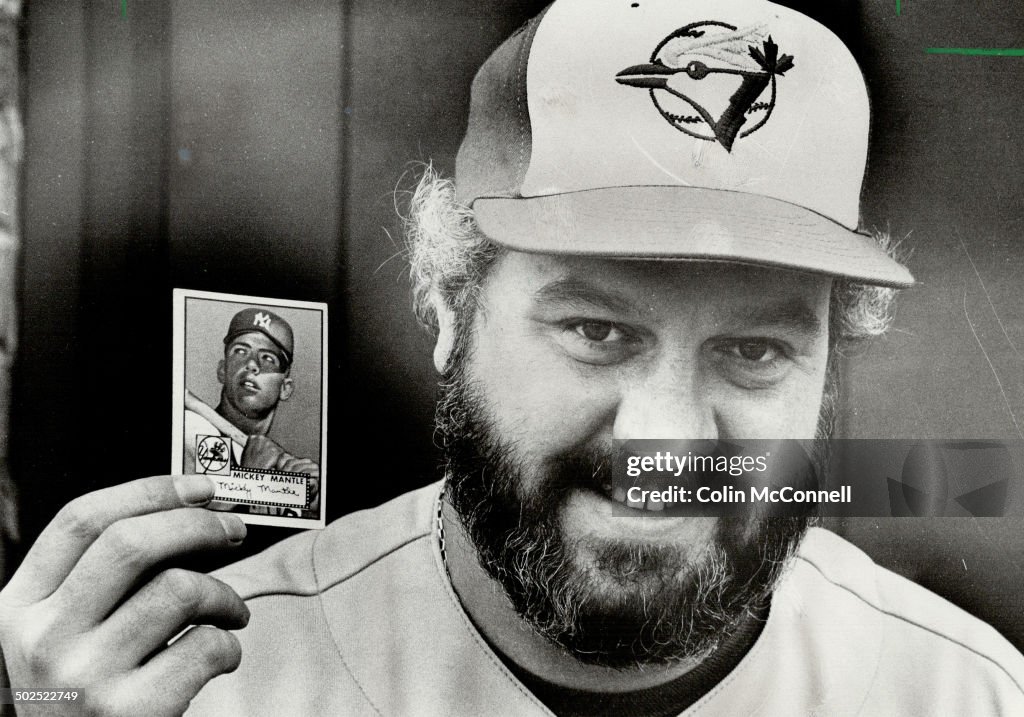 Mickey is art: Dave Crichton; 38; says the 1952 Mickey Mantle baseball card he's holding is a work o