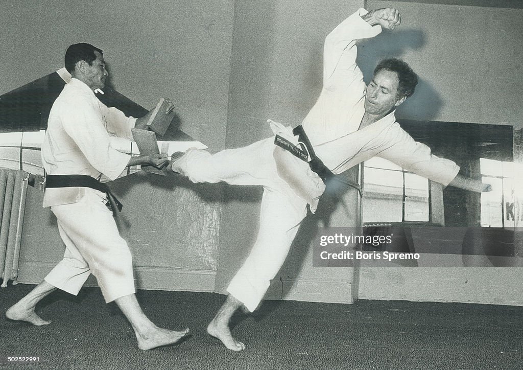 Weingust; 42; uses his foot to break piece of wood held by karate instructor Kyong Lee. The Toronto 