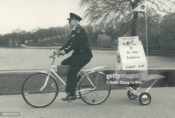 Firs-aid-mobile: St. John Ambulance Divisional Office Ken McOrmond pedals along the route of the Variety Club Bike-A-Thon near High Park ready to...