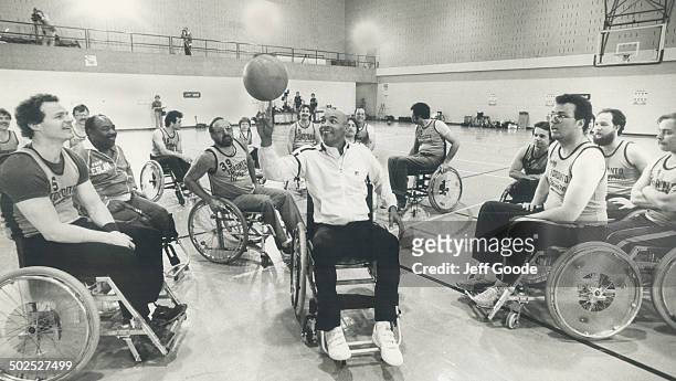 Wheel to wheel: Curly Neal of the Globetrotters displays his ball handling skills for the Toronto Spitfires at the Eboticke Olympium. The Trotters...