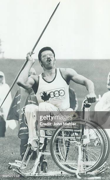 Taking a deep breath helps; Frank Henderson of Canada takes a deep breath as he prepares to throw javelin in action at Olympiad for the Physically...