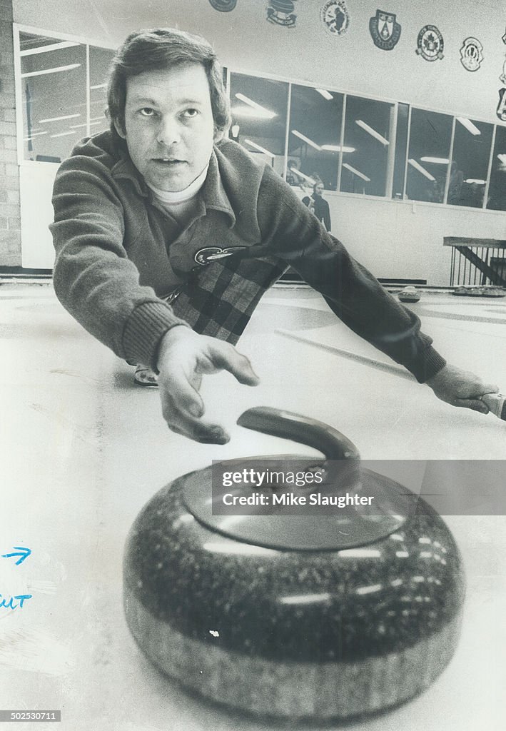 Steady hand: Skip Ron Green; defending Canada Life champion; carefully guides a shot during play in 