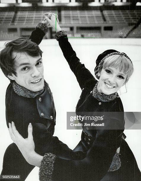 In perfect harmony: JoJo Starbuck and John Curry go through their routine at the Maple Leaf Gardens yesterday. Starbuck credits Curry; the British...