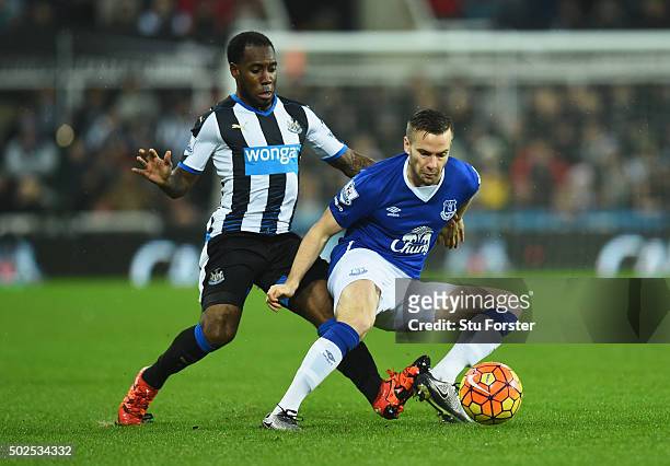 Tom Cleverley of Everton is watched by Vurnon Anita of Newcastle United during the Barclays Premier League match between Newcastle United and Everton...