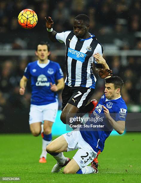 Moussa Sissoko of Newcastle United is tripped by Seamus Coleman of Everton during the Barclays Premier League match between Newcastle United and...