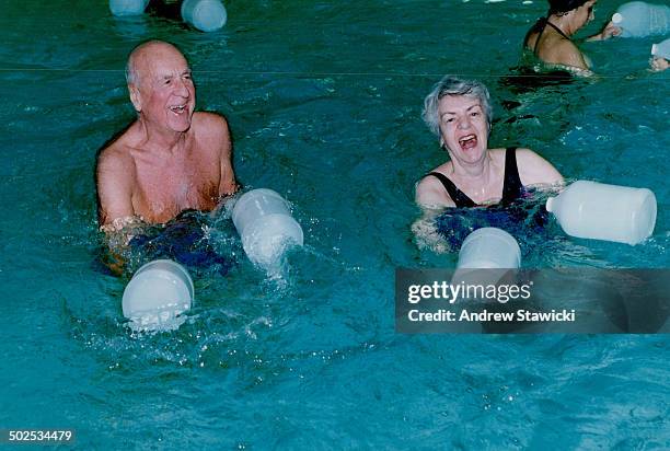 Underwater family: Jay Ingram and his half-delighted; half-terrified daughters Rachel; 6; and Amella; 3 1/2; smile below the surface of a YMCA pool....