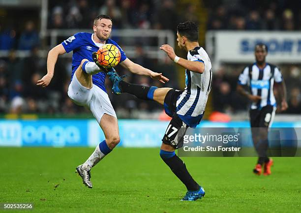 Tom Cleverley of Everton high-kicking with Ayoze Perez of Newcastle United during the Barclays Premier League match between Newcastle United and...