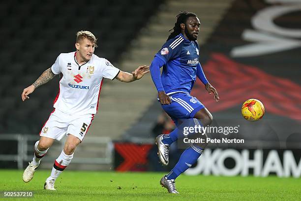 Kenwyne Jones of Cardiff City attempts to control the ball under pressure from Kyle McFadzean of Milton Keynes Dons during the Sky Bet Championship...