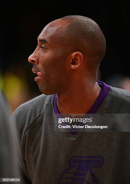 Kobe Bryant of the Los Angeles Lakers looks on during warm-up prior to the NBA game against the Los Angeles Clippers at Staples Center on December...