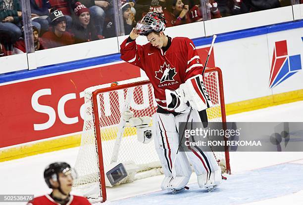 Canada's goalkeeper Mason McDonald reacts after conceeding during the 2016 IIHF World Junior Ice Hockey Championship match between USA and Canada in...