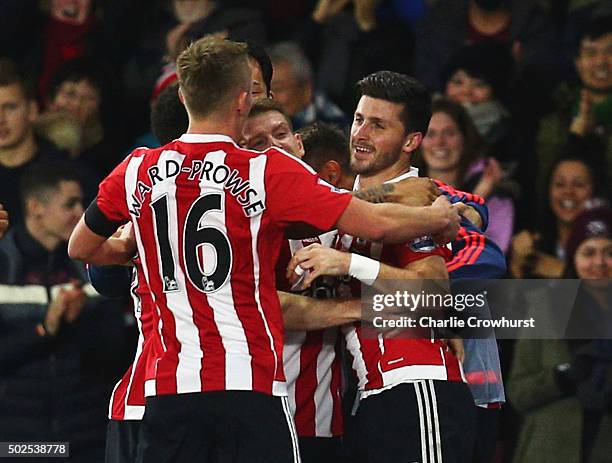 Shane Long of Southampton celebrates with team mates as he scores their second goal during the Barclays Premier League match between Southampton and...