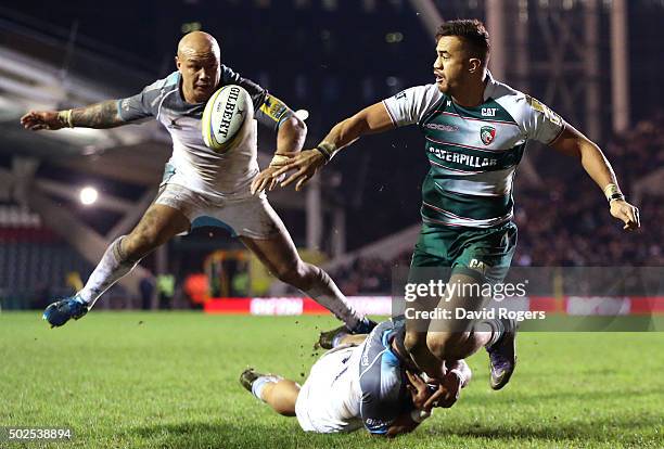 Peter Betham of Leicester offloads the ball during the Aviva Premiership match between Leicester Tigers and Newcastle Falcons at Welford Road on...