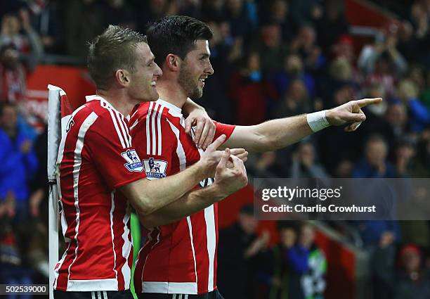 Shane Long of Southampton celebrates with Steven Davis as he scores their fourth goal during the Barclays Premier League match between Southampton...