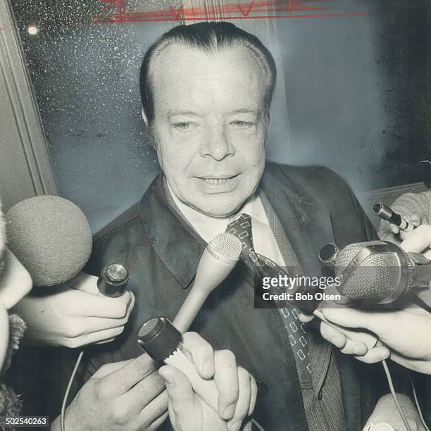Ontario treasurer John White is besieged by reporters yesterday. After Premier William Davis announced the government will withdraw its proposed 7...