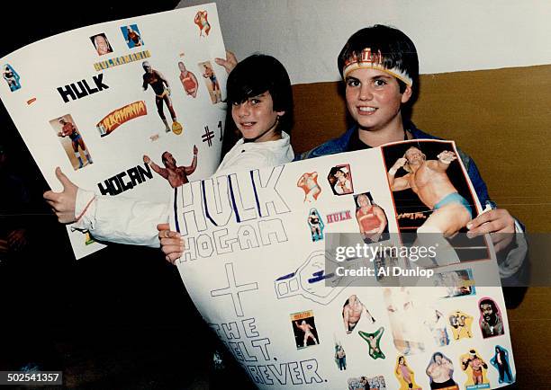 Craig Rosenblatt; above left; and Perry Argiropoulos; both 12; brought along home-made posters to cheer on their favorite wrestler; Hulk Hogan; as...