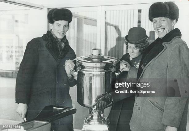 Samovar custodians Vladislav Trefjak and Vladivik Shapovalov; both goaltenders with Russian hockey team now on Canadian tour; let Air Canada hostess...