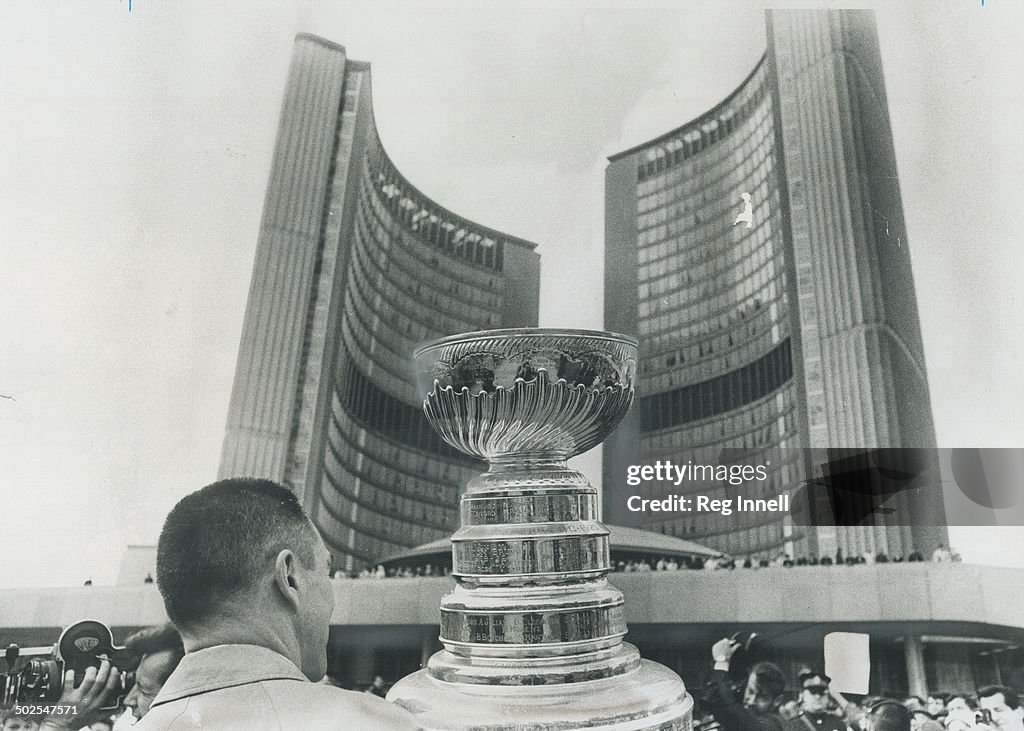 Toronto honors its maple leafs. Maple Leaf Captain George Armstrong (top) holds the Stanley Cup and 