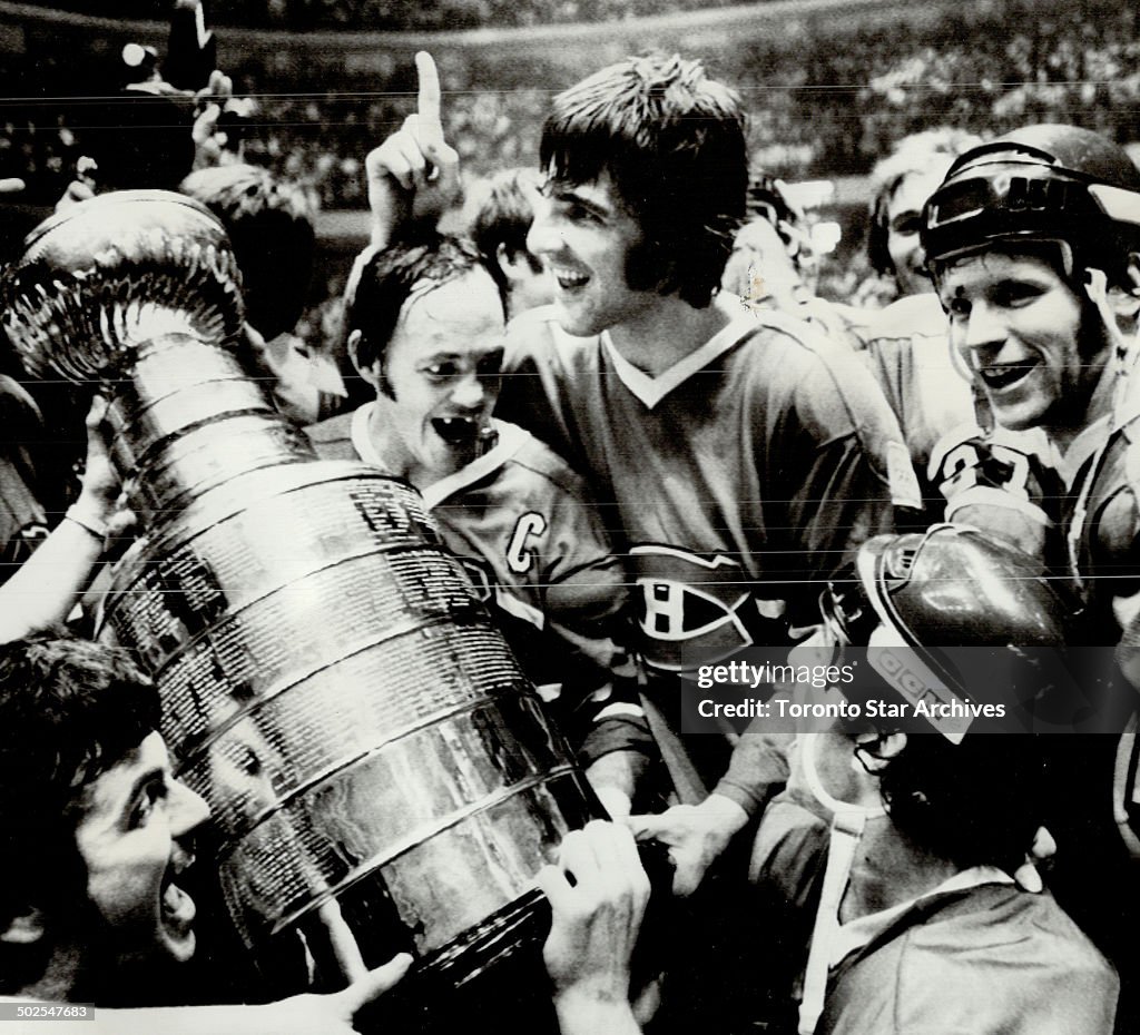 Captain and the cup: Montreal Canadiens' captain Yvan Court accepted Stanley Cup last night; climaxi