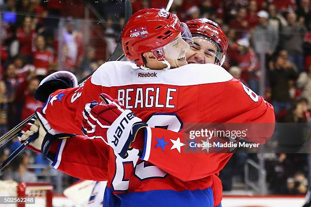 Tom Wilson of the Washington Capitals congratulates Jay Beagle after he scored against the Montreal Canadiens during the second period at Verizon...