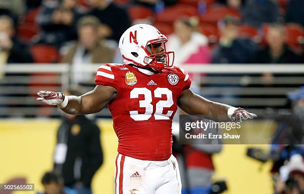 Imani Cross of the Nebraska Cornhuskers reacts after running in for a touchdown against the UCLA Bruins during the Foster Farms Bowl at Levi's...