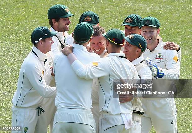 Peter Siddle of Australia celebrates after taking the wicket of Jason Holder of the West Indies during day two of the Second Test match between...