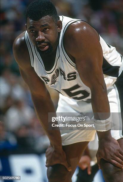 Antoine Carr of the San Antonio Spurs looks on against the Phoenix Suns during an NBA basketball game circa 1992 at the HemisFair Arena in San...