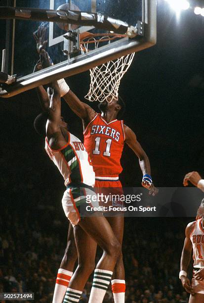 Caldwell Jones of the Philadelphia 76ers attempts to block the shot of Sidney Moncrief of the Milwaukee Bucks during an NBA basketball game circa...