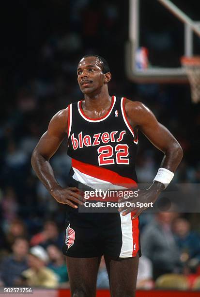 Clyde Drexler of the Portland Trail Blazers looks on against the Washington Bullets during an NBA basketball game circa 1990 at the Capital Centre in...