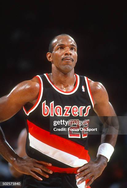 Clyde Drexler of the Portland Trail Blazers looks on against the Washington Bullets during an NBA basketball game circa 1990 at the Capital Centre in...