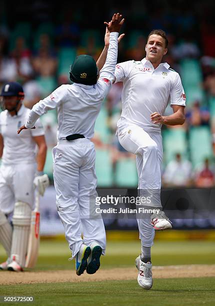 Morne Morkel of South Africa celebrates taking the wicket of Moeen Ali of England during day two of the 1st Test between South Africa and England at...
