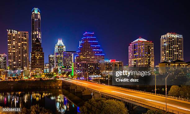 austin texas evening excitement cityscape, skyline, skyscrapers, congress avenue bridge - austin texas stockfoto's en -beelden