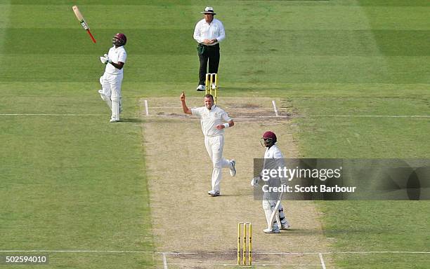 Peter Siddle of Australia celebrates after dismissing Denesh Ramdin of the West Indies as non striker Darren Bravo of the West Indies throws his bat...