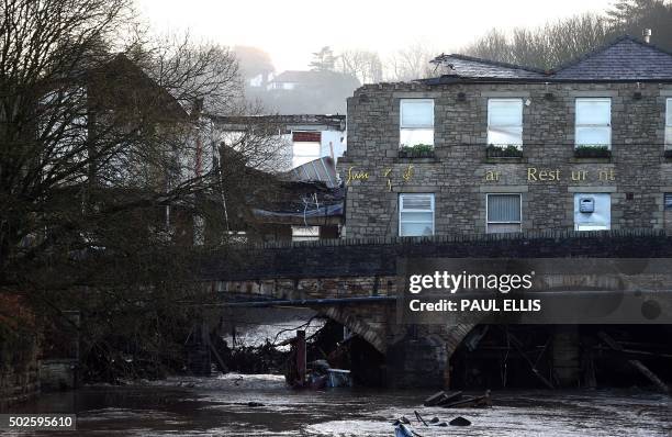 Damage to The Waterside Pub, a two hundred year old public house is pictured on December 27 the day after the River Irwell, swelled by exceptionally...